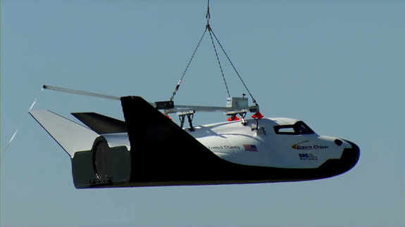 Sierra Nevada Corporation (SNC) Space Systems' Dream Chaser flight vehicle is lifted by an Erickson Air-Crane helicopter near the Rocky Mountain Metropolitan Airport in Jefferson County, Colo., on May 29, during a captive-carry test.