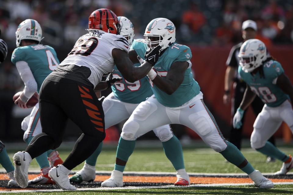 Dolphins offensive tackle Greg Little (75) blocks Bengals defensive tackle Kahlil McKenzie during a game last season in Cincinnati.