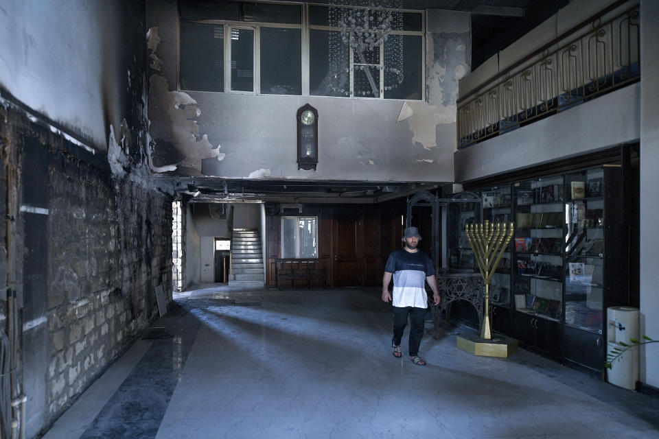 A man walks in the damaged Kele-Numaz synagogue in Derbent, Russia, on Tuesday, June 25, 2024. Jews in the predominantly Muslim region of Dagestan in southern Russia say they are determined to regroup and rebuild following a deadly attack by Islamic militants on June 23 on Christian and Jewish houses of worship in Derbent and the regional capital of Makhachkala. (AP Photo)