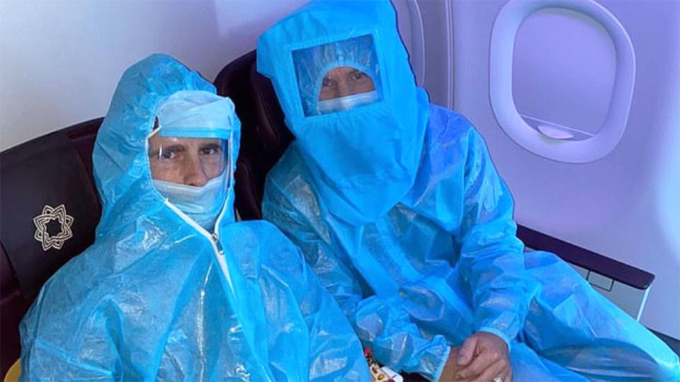 Cricketers Kane Williamson and David Warner are seen here in full PPE on a flight in India. Pic: Twitter