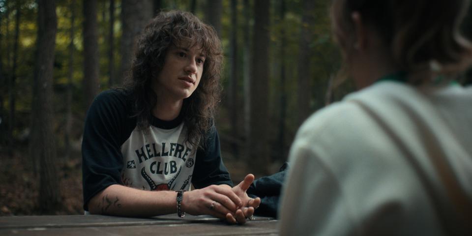 Eddie and Chrissy in the woods in "Stranger Things"