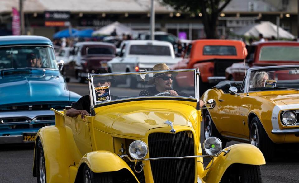 Classic car owners cruise down McHenry Avenue during the Graffiti Parade in Modesto, Calif., Friday, June 9, 2023. Andy Alfaro/aalfaro@modbee.com