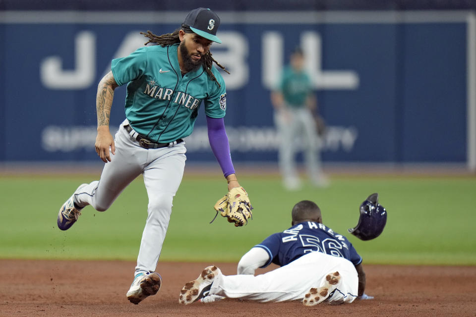 Tampa Bay Rays' Randy Arozarena (56) steals second base under the tag by Seattle Mariners shortstop J.P. Crawford during the third inning of a baseball game Thursday, Sept. 7, 2023, in St. Petersburg, Fla. (AP Photo/Chris O'Meara)