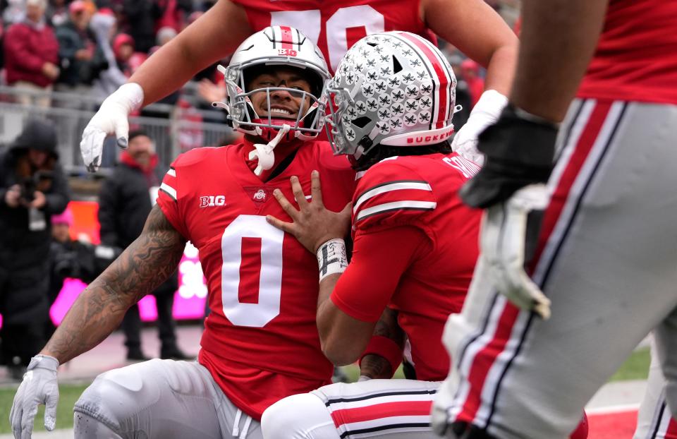 Nov 12, 2022; Columbus, Ohio, USA; Ohio State Buckeyes wide receiver Kamryn Babb (0) celebrates his touchdown in the fourth quarter of their NCAA Division I football game between the Ohio State Buckeyes and the Indiana Hoosiers at Ohio Stadium. Mandatory Credit: Brooke LaValley-The Columbus Dispatch