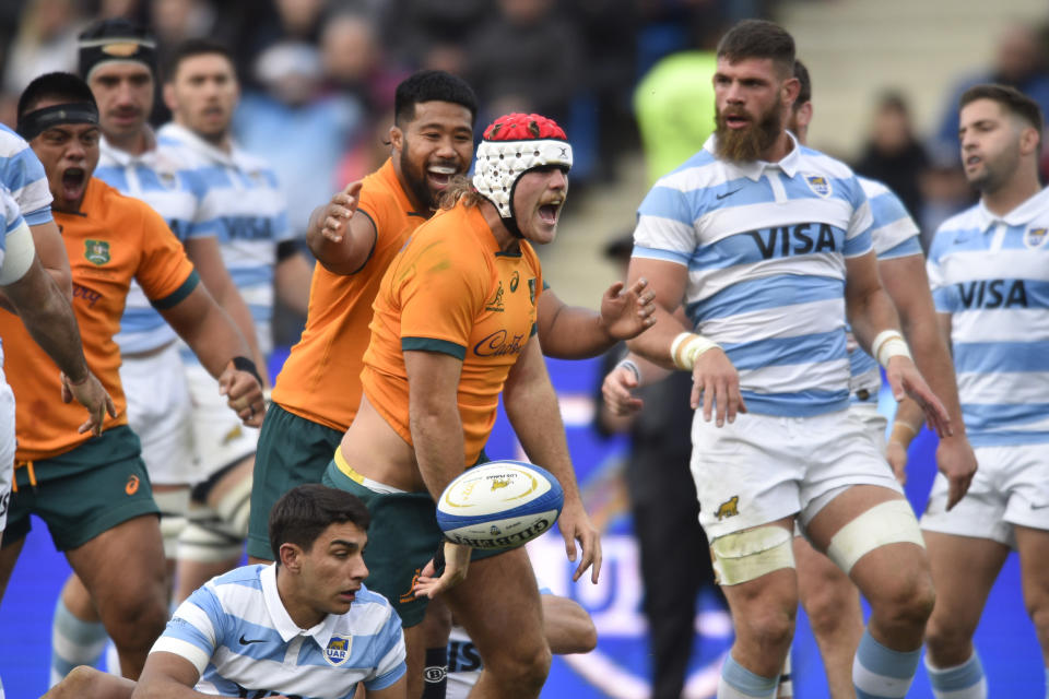 Australia's Fraser McReight, center, celebrates his try during a rugby championship match against Argentina, in Mendoza, Argentina, Saturday, Aug. 6, 2022. (AP Photo/Gustavo Garello)