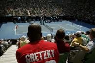 Spectators watch the fourth round match between Canada's Milos Raonic and Switzerland's Stan Wawrinka at the Australian Open tennis tournament at Melbourne Park, Australia, January 25, 2016. REUTERS/Brandon Malone