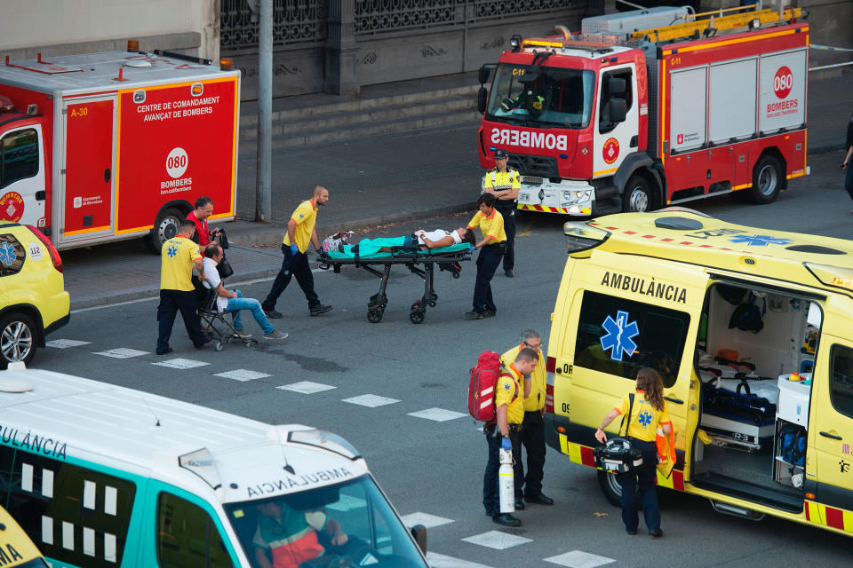 <p>A victim is stretchered towards emergency vehicles parked outfront of the Estacio de Franca (Franca station) in central Barcelona on July 28, 2017 after a regional train appears to have hit the end of the track inside the station injuring dozens of people. (Photo: Josep Lagos/AFP/Getty Images) </p>