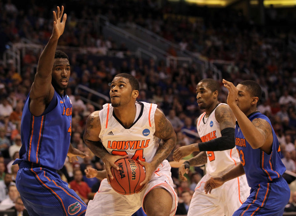 PHOENIX, AZ - MARCH 24: Casey Prather #24 of the Florida Gators looks to shoot over Patric Young #4 of the Florida Gators during the 2012 NCAA Men's Basketball West Regional Final at US Airways Center on March 24, 2012 in Phoenix, Arizona. (Photo by Jamie Squire/Getty Images)