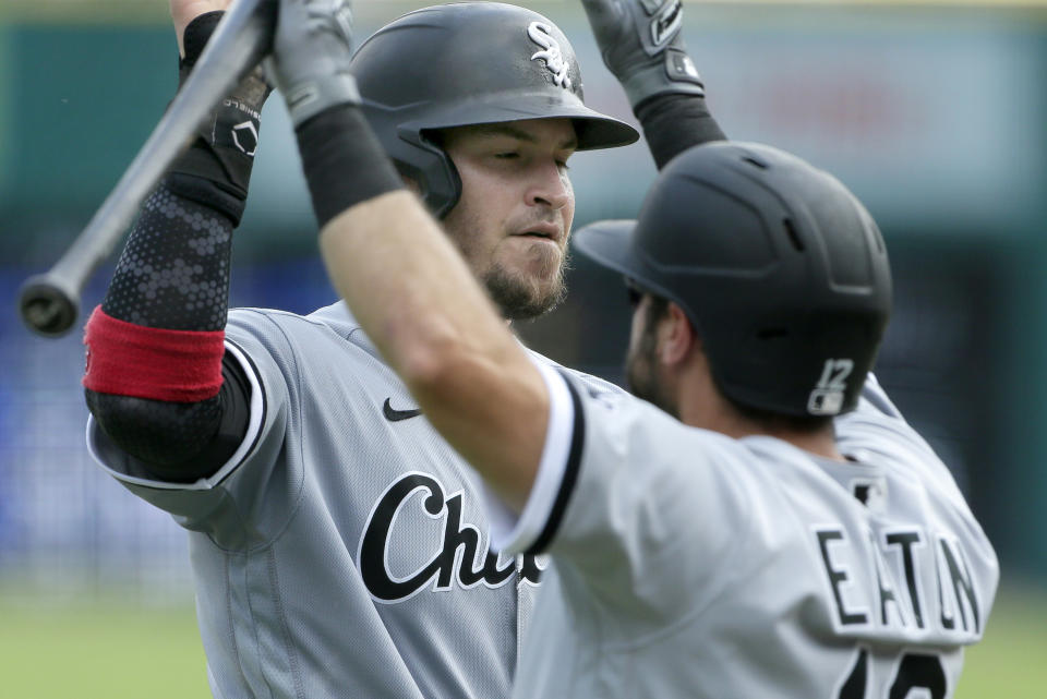 Yasmani Grandal of the Chicago White Sox celebrates with Adam Eaton after scoring against the Detroit Tigers. (Photo by Duane Burleson/Getty Images)