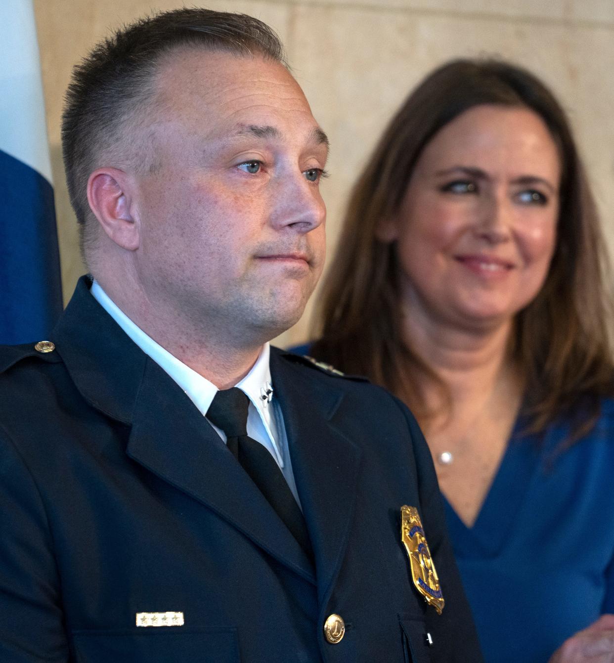 Newly-sworn in Chief of the Indianapolis Metropolitan Police Department Christopher Bailey stands by his family, including his wife, Dawn Bailey, right, Monday, Feb. 12, 2024 during a press conference at the City/County Building.