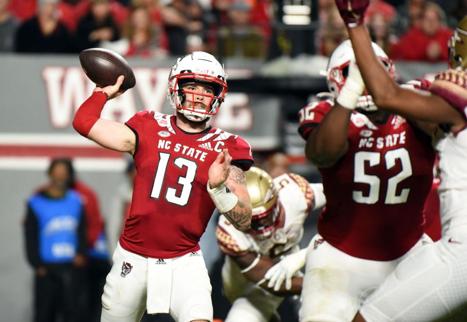 NC State quarterback Devin Leary (13) throws a pass during the first half against the Florida State Seminoles at Carter-Finley Stadium. Oct. 8, 2022