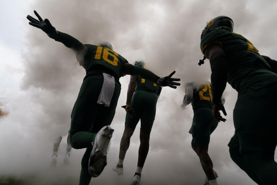 Baylor wide receiver Hal Presley (16) and teammates run onto the field for an NCAA college football game against Albany in Waco, Texas, Saturday, Sept. 3, 2022. (AP Photo/LM Otero)