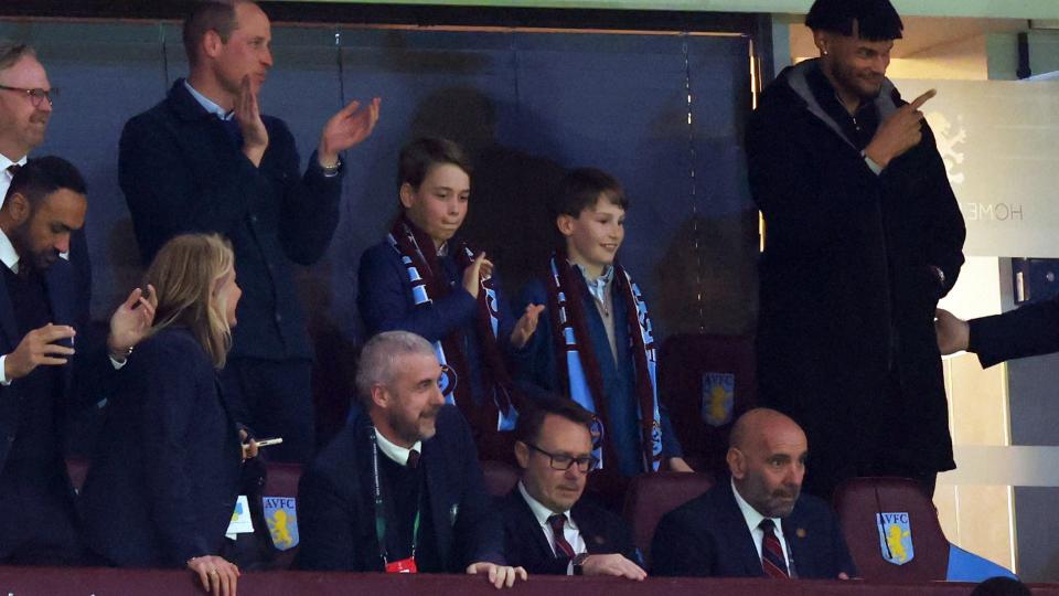 Prince William, Prince of Wales and Prince George of Wales look on alongside Tyrone Mings of Aston Villa during the UEFA Europa Conference League 2023/24 Quarter-final