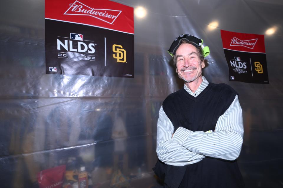 Peter Seidler celebrates in the Petco Park clubhouse after the Padres knocked out the Dodgers in the 2022 NLDS.