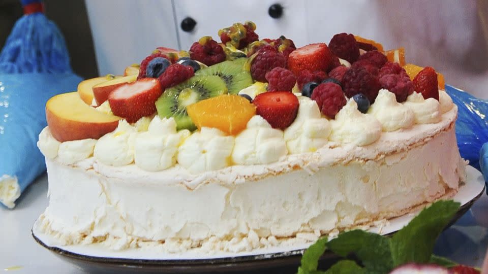 A pavlova cake is typically served with summer fruits heaped on top. - Vince Caligiuri/Getty Images