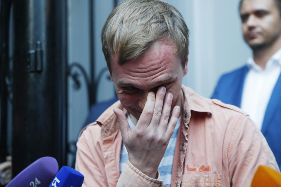 Prominent Russian investigative journalist Ivan Golunov, cries as he leaves a Investigative Committee building in Moscow, Russia, Tuesday, June 11, 2019. In a surprising turnaround, Russia's police chief on Tuesday dropped all charges against a prominent investigative reporter whose detention sparked public outrage and promised to go after the police officers who tried to frame the journalist as a drug-dealer. (AP Photo/Pavel Golovkin)