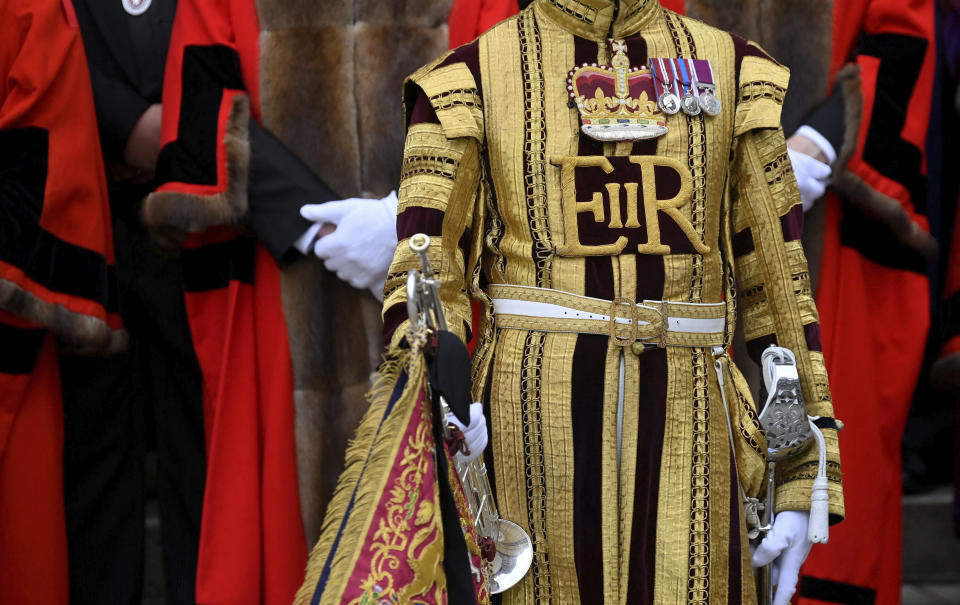 A band member wearing a ceremonial uniform with the royal cypher of the late Queen Elizabeth II, during the Proclamation of Accession of King Charles III at the Royal Exchange in the City of London, Saturday, Sept. 10, 2022. King Charles III has been officially announced as Britain’s monarch in a ceremony steeped in ancient tradition and political symbolism and, for the first time, broadcast live. (Toby Melville/Pool Photo via AP)