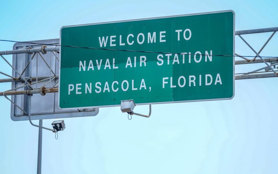 Signage located above the Bayou Grande Bridge leading to the Pensacola Naval Air Station following a shooting on December 06, 2019 in Pensacola, Florida. The second shooting on a U.S. Naval Base in a week has left three dead plus the suspect and seven people wounded. - Getty Images North America