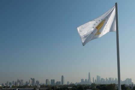 Sep 25, 2017; Jersey City, NJ, USA; A Presidents Cup flag with the New York City skyline in the background during The Presidents Cup golf tournament at Liberty National Golf Course. Mandatory Credit: Bill Streicher-USA TODAY Sports