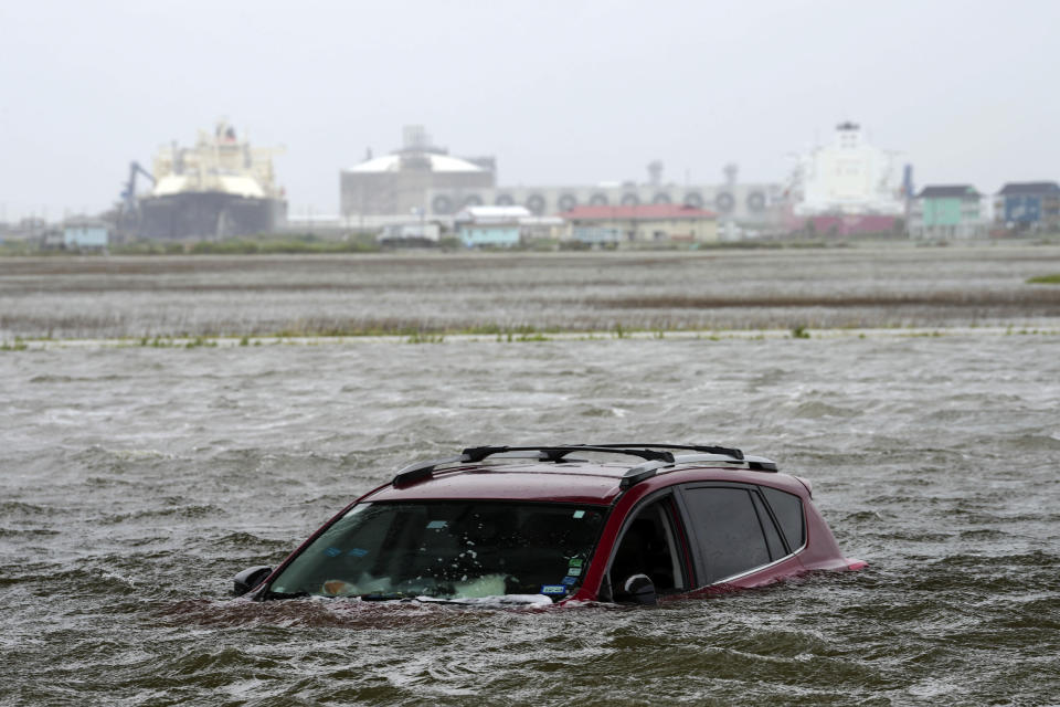 A car sits submerged underwater after Tropical Storm Alberto hits the Gulf Coast area.