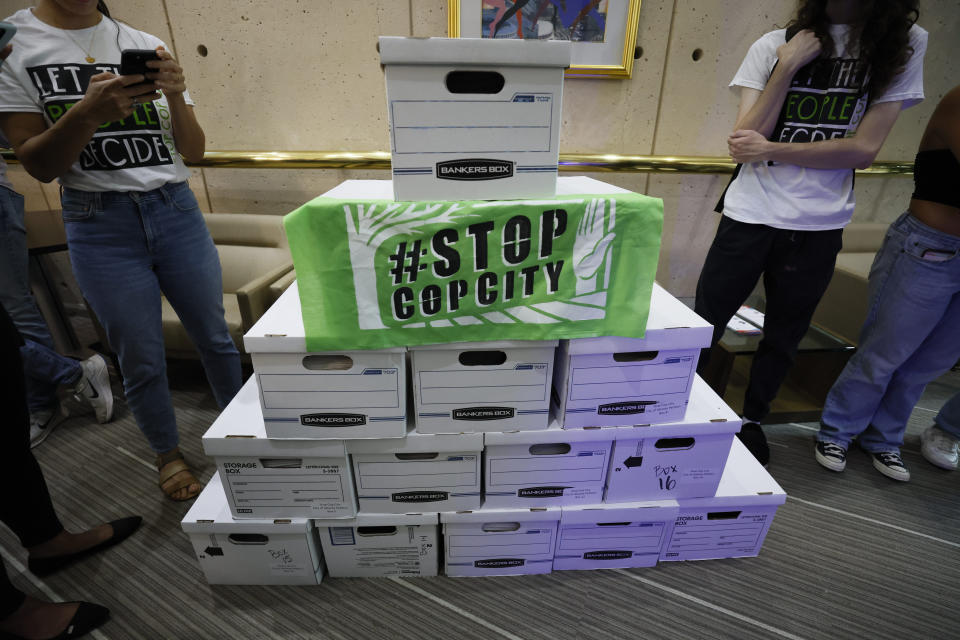 FILE - Dozens of boxes full of signed petitions are delivered to Atlanta City Hall, Monday, Sept. 11, 2023, to force a referendum on the future of a planned police and firefighter training center. While city officials have not yet tried to count the petitions, an analysis by four news organizations finds it’s unclear whether petitions have enough valid entries to force the citywide vote, with nearly half the entries unable to be matched to eligible registered Atlanta voters. (Miguel Martinez/Atlanta Journal-Constitution via AP, File) /Atlanta Journal-Constitution via AP)