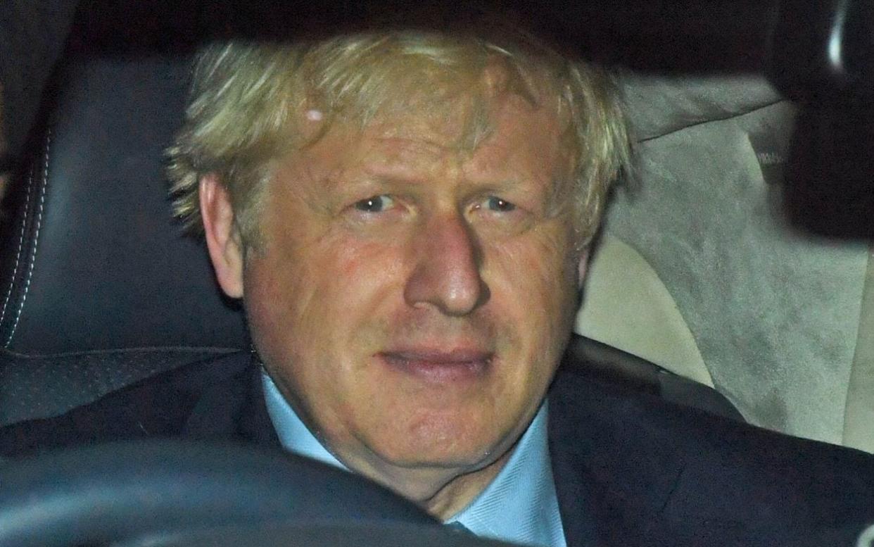 Late night: Boris Johnson is driven away from the House of Commons after a series of heated exchanges - PA