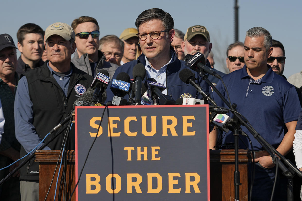 U.S. House Speaker Mike Johnson speaks while standing with Republican members of Congress, Wednesday, Jan. 3, 2024, in Eagle Pass, Texas. Johnson is leading about 60 fellow Republicans in Congress on a visit to the Mexican border. Their trip comes as they are demanding hard-line immigration policies in exchange for backing President Joe Biden's emergency wartime funding request for Ukraine. (AP Photo/Eric Gay)