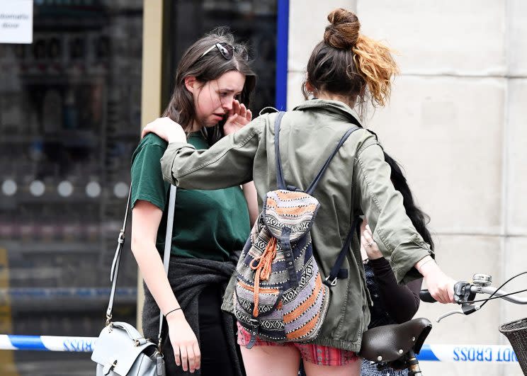 Women react as they stand near London Bridge in London, June 4, 2017. (Photo: Dylan Martinez/Reuters)