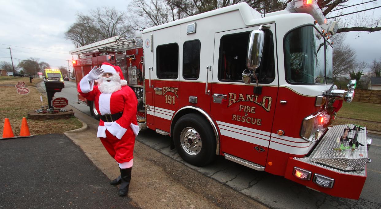 Santa arrives by Fire Engine to the Norman family’s home on Spencer Mountain Road in Ranlo Saturday afternoon, Dec. 18, 2021, during the second annual Santa’s Mailbox event.