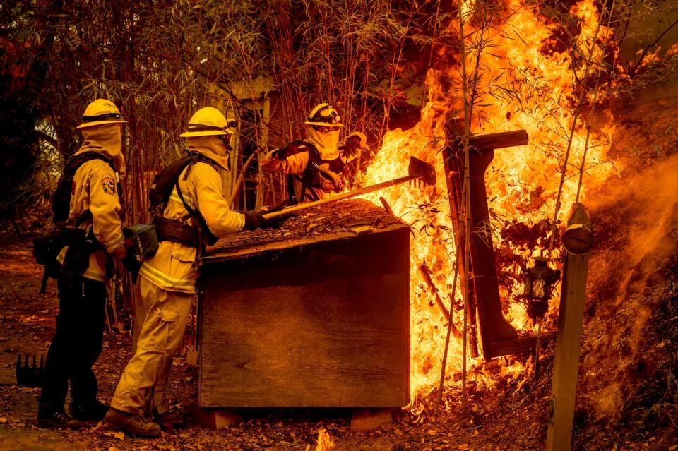 Firefighters tackle the blaze (AP)