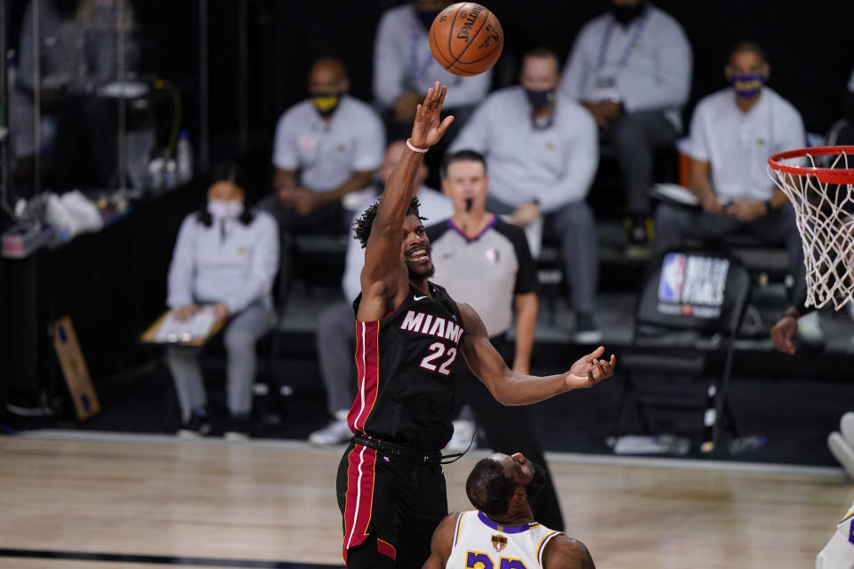 Miami Heat's Jimmy Butler (22) shoot the ball against the Los Angeles Lakers during the second half in Game 3 of basketball's NBA Finals, Sunday, Oct. 4, 2020, in Lake Buena Vista, Fla. (AP Photo/Mark J. Terrill)