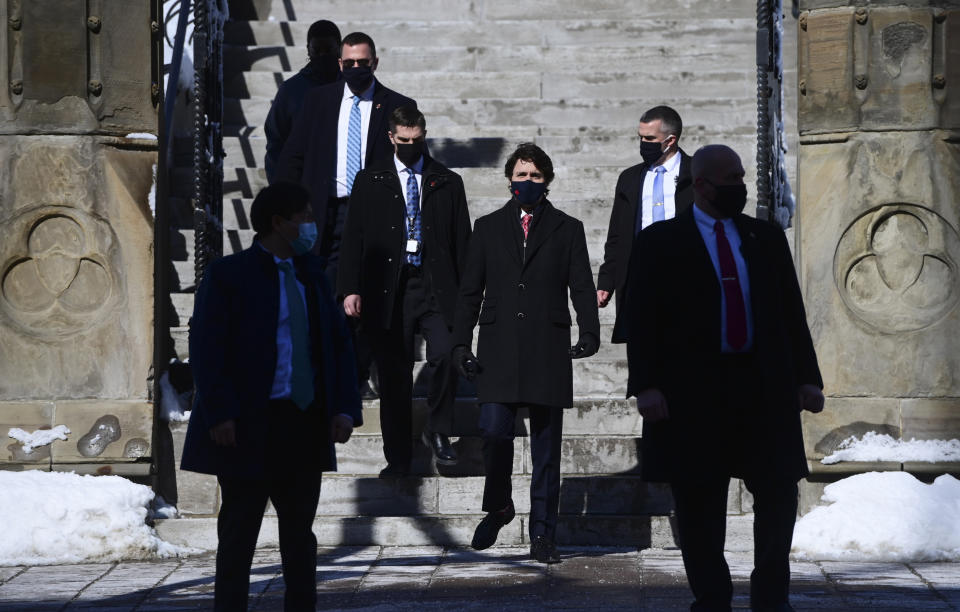 Canadian Prime Minister Justin Trudeau makes his way to hold a press conference in Ottawa, Ontario, on Friday, Feb. 26, 2021, to provide an update on the COVID-19 pandemic and vaccine roll-out in Canada. (Sean Kilpatrick/The Canadian Press via AP)