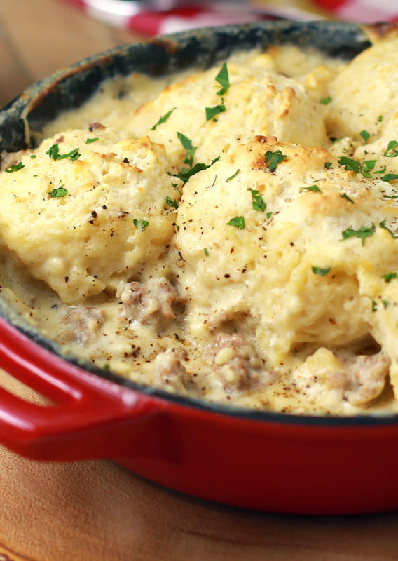 The Slow Roasted Italian<p>This is a one-skillet recipe that is sure to make it into your permanent recipe file. Flavorful saw mill gravy made with sausage and scrumptious biscuits that goes from prep to plate in 30 minutes.</p><p><strong>Get the recipe: <a href="https://www.theslowroasteditalian.com/2013/11/sausage-gravy-and-biscuit-skillet-recipe.html" rel="sponsored" target="_blank" data-ylk="slk:Sausage Gravy and Biscuit Skillet;elm:context_link;itc:0;sec:content-canvas" class="link ">Sausage Gravy and Biscuit Skillet</a></strong></p>