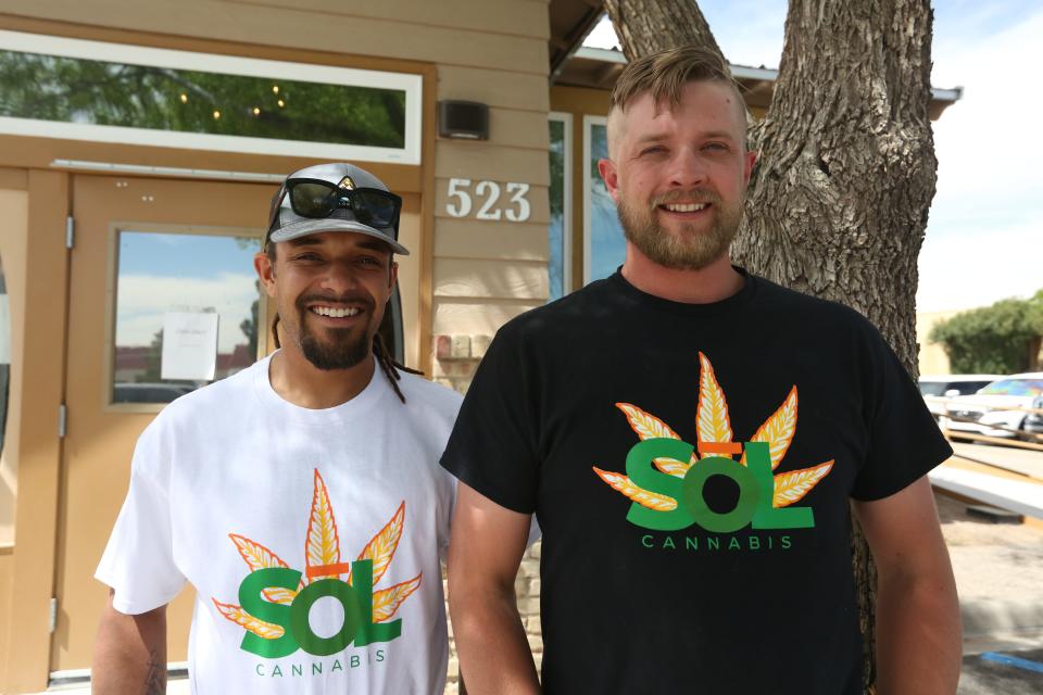 Sol Cannabis founders Kwame Ponschock, left, and Brett Burke are pictured outside their dispensary on East Idaho Avenue in Las Cruces on April 15, 2022.