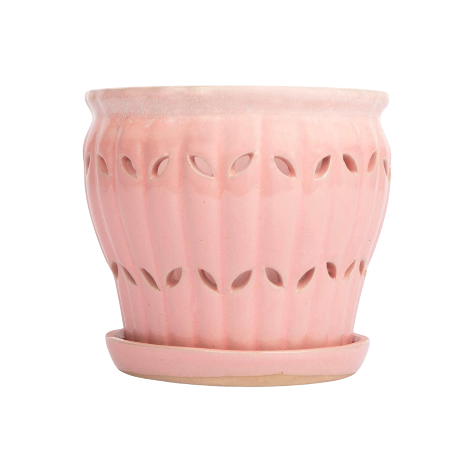A pink ceramic fluted planter