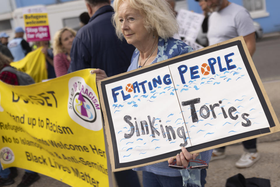 PORTLAND, ENGLAND - JULY 18: Members of Stand Up To Racism stage a counter demonstration outside the port entrance as the Bibby Stockholm migrant barge arrives at Portland Harbour on July 18, 2023 in Portland, England. The Bibby Stockholm arrives in Portland, after a refit at Falmouth, to serve as living quarters for up to 500 asylum seekers to the UK. (Photo by Dan Kitwood/Getty Images)