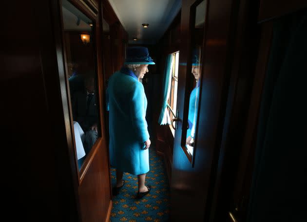 Queen Elizabeth II travels on a train pulled by the steam locomotive 'Union of South Africa' between engagements in Scotland on Sept. 9, 2015. (Photo: Andrew Milligan/Pool/AFP via Getty Images)