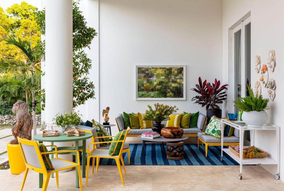 Nadia Watts Interior Design chose a color scheme of yellow, green, blue and gray for the front loggia of the 2024 Kips Bay Decorator Show House Palm Beach, which is open through March 17 in West Palm Beach.