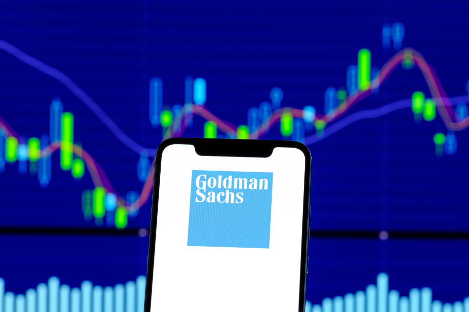 HONG KONG, CHINA - 2018/12/28:  In this photo illustration, the Goldman Sachs logo is seen displayed on an Android smartphone over stock chart. (Photo Illustration by Daniel Fung/SOPA Images/LightRocket via Getty Images)