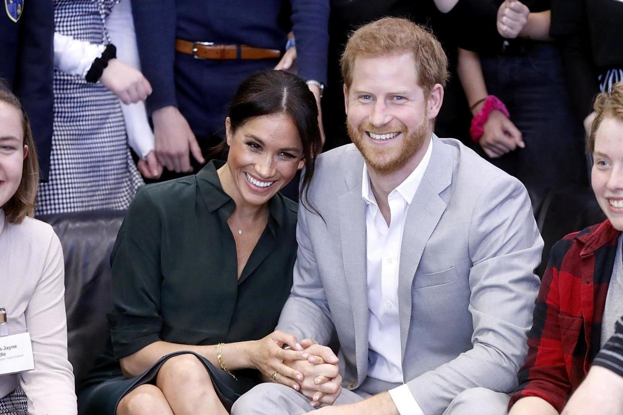 Meghan and Harry look smitten on a trip to Sussex on Wednesday: REUTERS