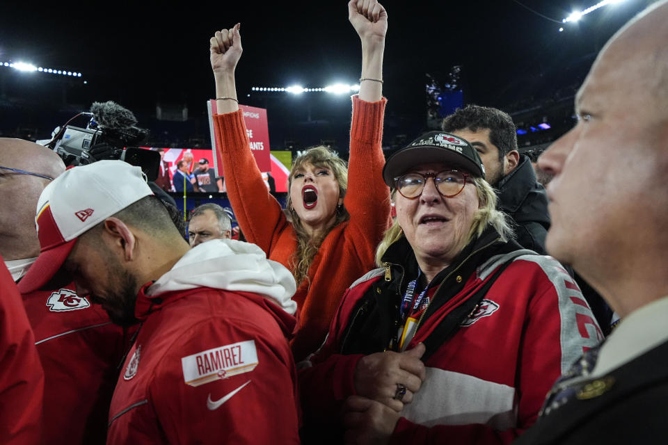 Taylor Swift, left, and Donna Kelce watch the Kansas City Chiefs receive the Lamar Hunt trophey after an AFC Championship NFL football game between the Baltimore Ravens and the Kansas City Chiefs, Sunday, Jan. 28, 2024, in Baltimore. The Kansas City Chiefs won 17-10. (AP Photo/Julio Cortez)