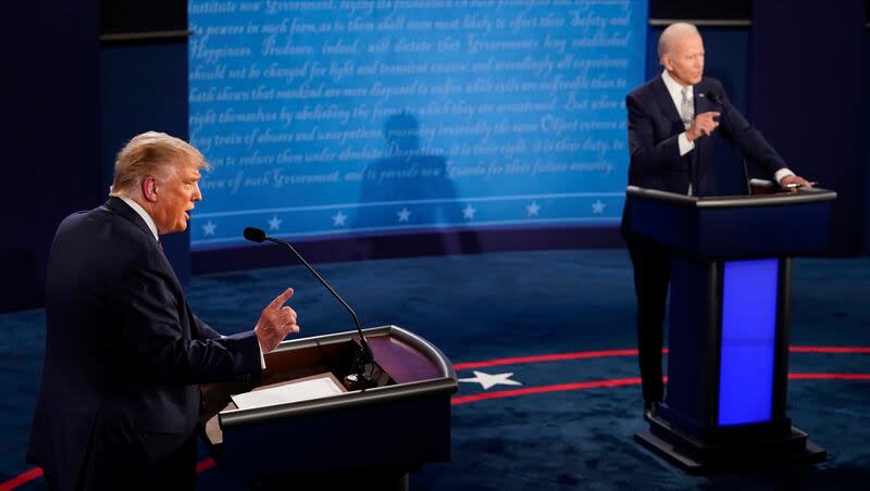 Then-President Donald Trump and then-presidential candidate former Vice President Joe Biden exchange points during the first presidential debate, Sept. 29, 2020, at Case Western University and Cleveland Clinic, in Cleveland, Ohio. On Wednesday, May 15, 2024, Biden challenged Trump to a pair of debates, the first in June.