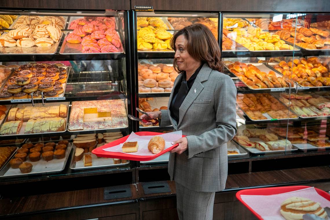 Vice President Kamala Harris fills a tray with baked goods during a visit to Panaderia Artisanal, a Latina-owned bakery on Monday, January 30, 2023 in Raleigh, N.C.