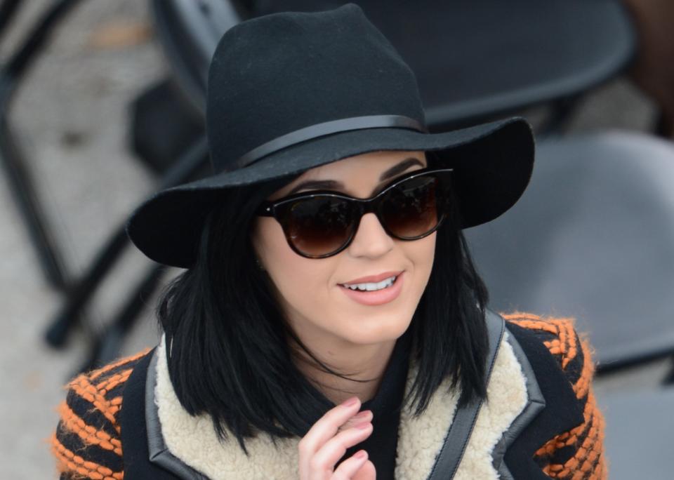 Singers Katy Perry arrives to be seated for the 57th Presidential Inauguration on January 21, 2013 at the US Capitol in Washington, DC. The Pop princess was a starlet in stripes Monday, bundling up in the chill as she joined a bevy of celebrities at Barack Obama's second presidential inauguration