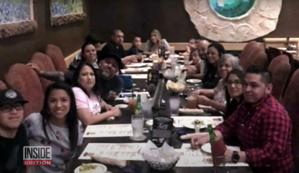 Tony Green and his extended family pictured at a dinner party.