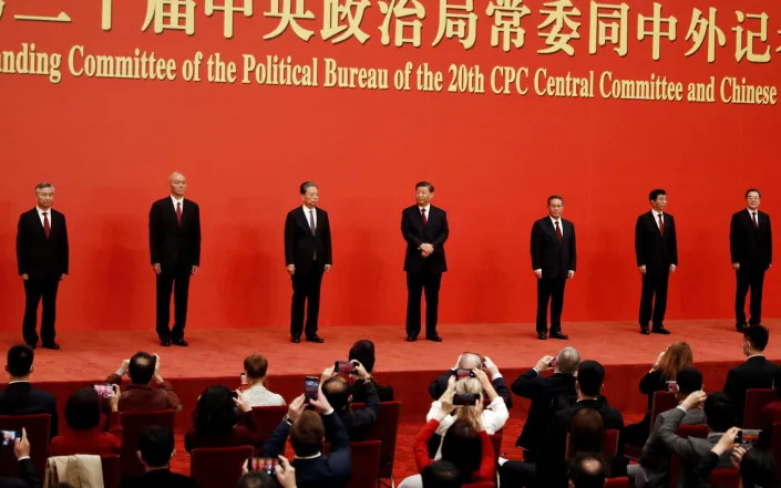 New Politburo Standing Committee members Xi Jinping, Li Qiang, Zhao Leji, Wang Huning, Cai Qi, Ding Xuexiang and Li Xi meet the media following the 20th National Congress of the Communist Party of China - TINGSHU WANG /REUTERS