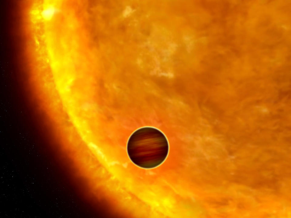 An artist's impression shows a Jupiter-sized planet passing in front of its parent star. Such events are called transits. When the planet transits the star, the star's apparent brightness drops by a few percent for a short period. Through this technique, astronomers can use the Hubble Space Telescope to search for planets across the galaxy by measuring periodic changes in a star's luminosity. The first class of exoplanets found by this technique are the so-called "hot Jupiters," which are so close to their stars they complete an orbit within days, or even hours. REUTERS/NASA/ESA/G. Bacon/Handout