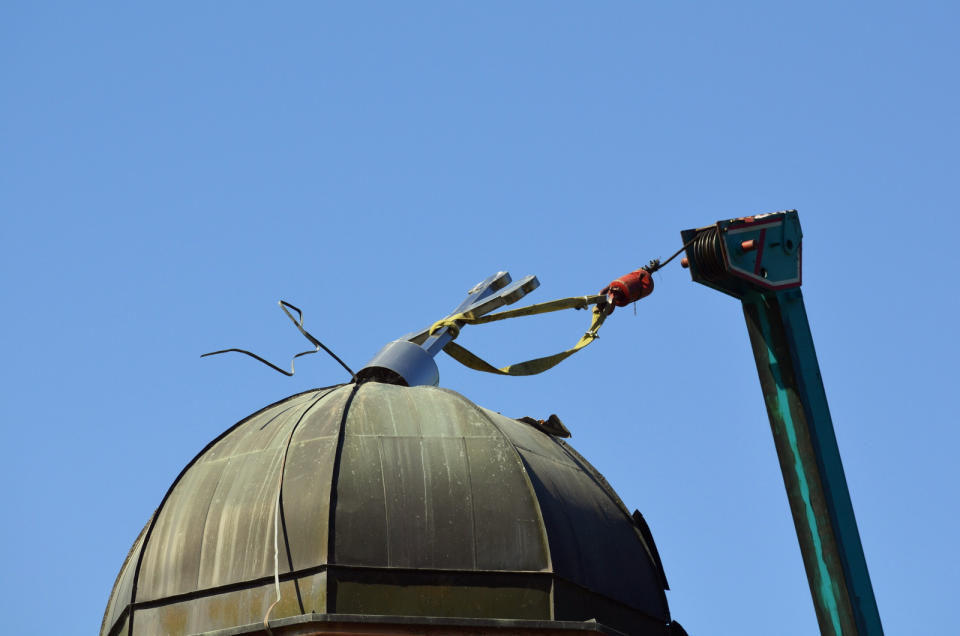 An orthodox church is demolished in Konjevic Polje, the village next to Srebrenica in Bosnia, Saturday, June 5, 2021. Bosnian authorities have demolished a Serbian Orthodox church illegally built on the land owned by a Bosniak woman after a 20-year-long legal battle that reached the European Court of Human Rights. Workers and construction machinery arrived at Fata Orlovic’s yard in the village of Konjevic Polje early Saturday. (AP Photo/Sladjan Vasic)