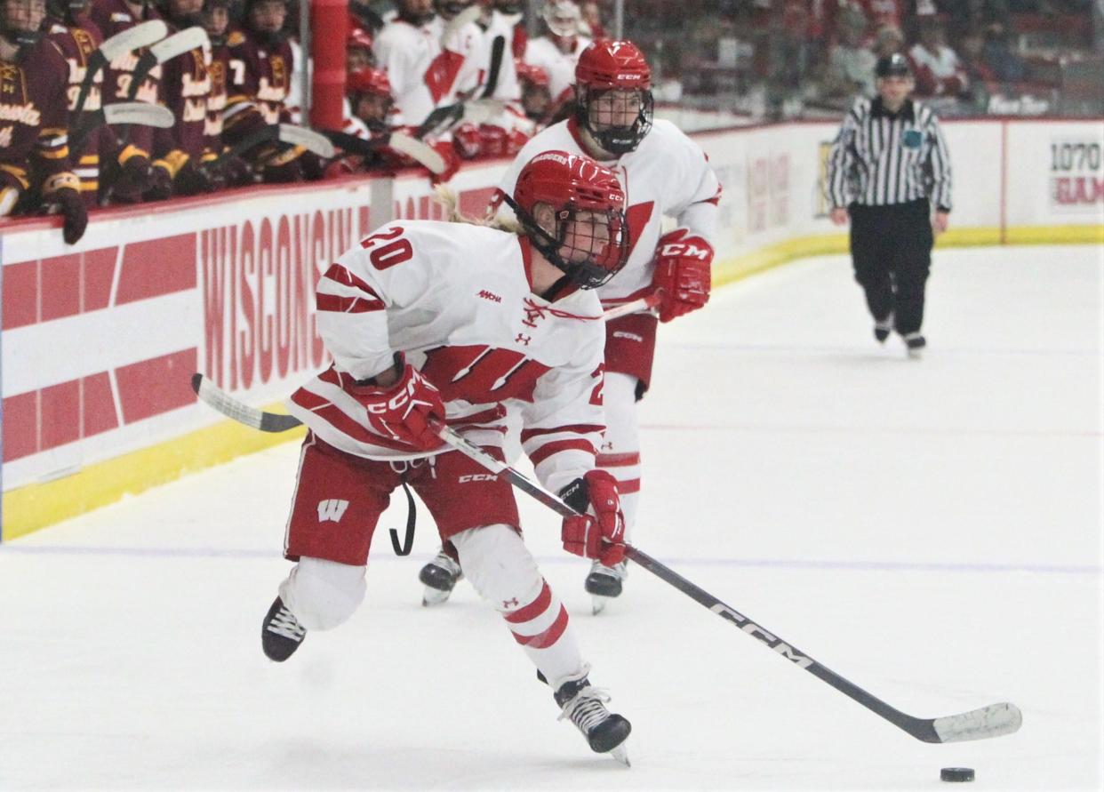 Wisconsin's Vivian Jungels (20) controls the puck during the final period against Minnesota Duluth at LaBahn Arena Sunday Dec. 3, 2023 in Madison, Wisconsin.