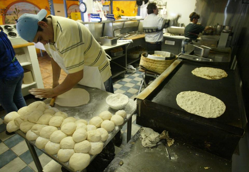 2012: Alfredo Miguel Aguilar makes oversized tortillas for Rafa's Burritos' famous giant burritos.